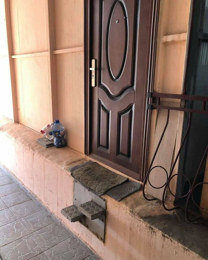 A doorway with two metal steps used to bridge the gap to the entrance, a unique example of Slavic Science.