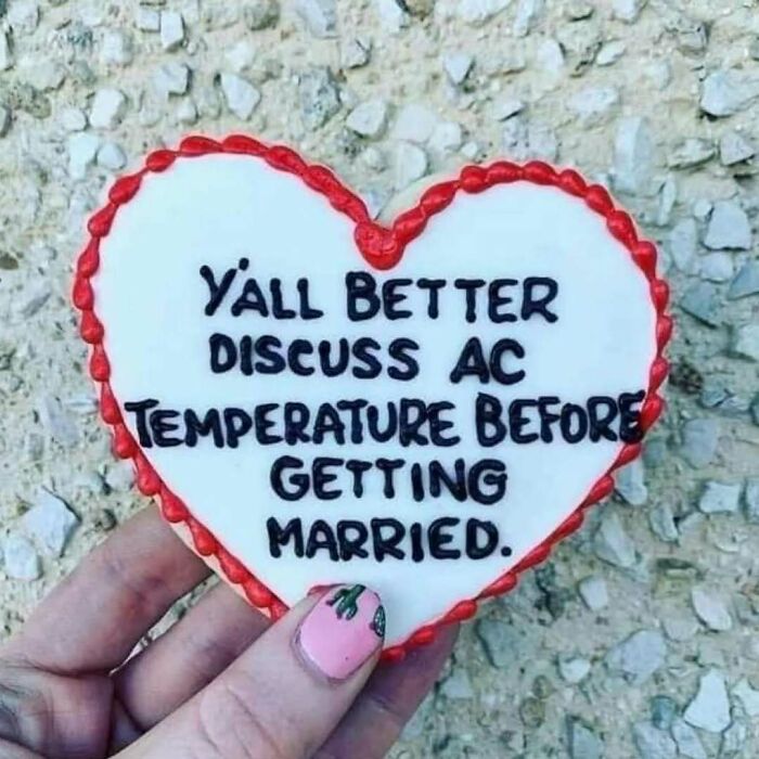 Heart-shaped cookie with funny marriage meme about AC temperature
