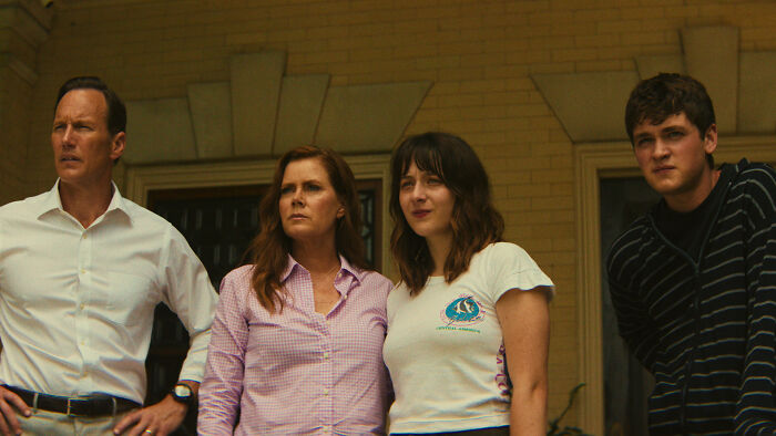 Group of Cape Fear characters standing outside house