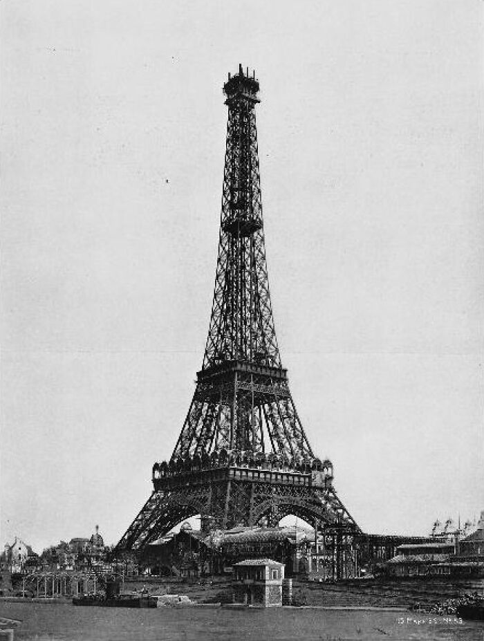 Black and white photo of Eiffel Tower construction symbolizing historical vengeance