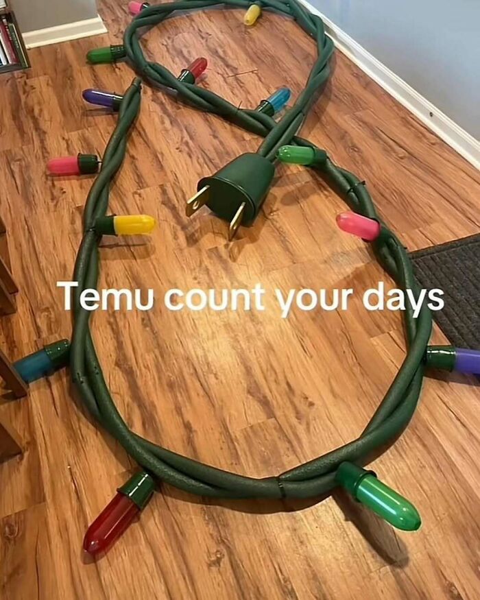 Christmas lights shaped like a large noose on hardwood floor