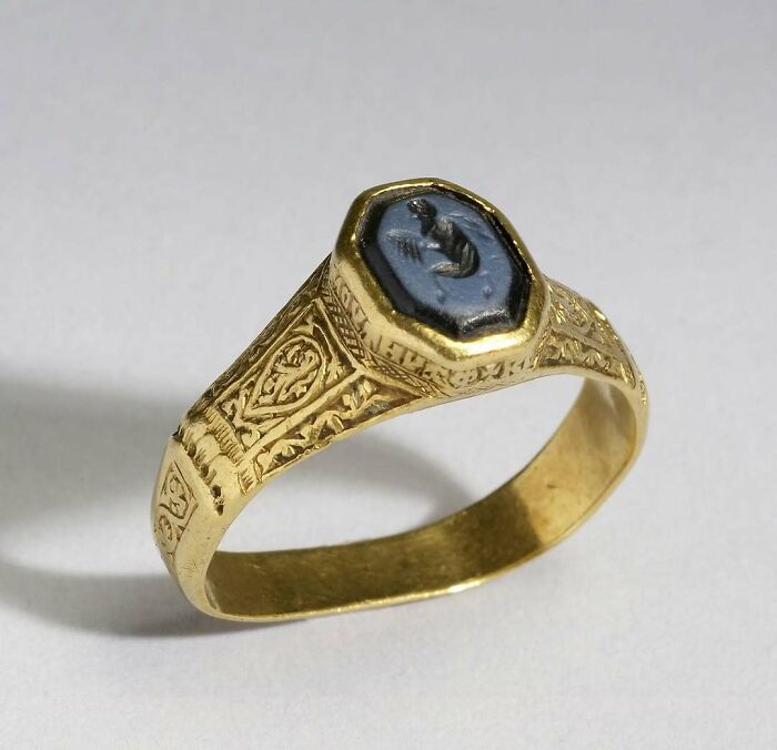 Gold ring with engraved blue gemstone historical treasures