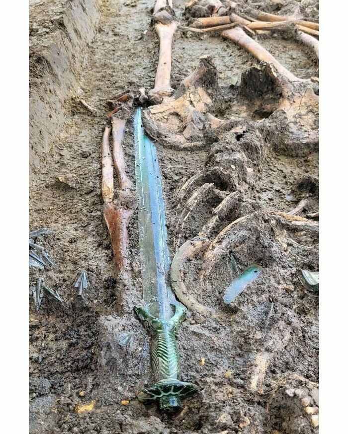 Preserved ancient glass sword found in an archaeological dig alongside human skeleton