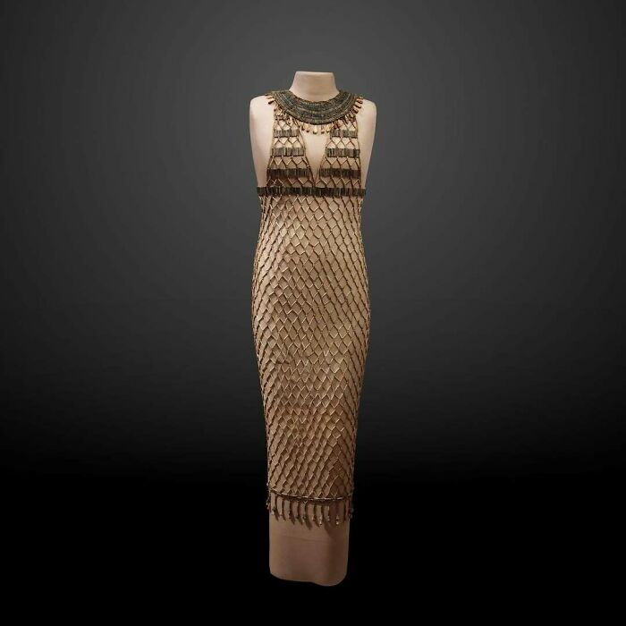 Vintage Egyptian beaded dress displayed on mannequin historical treasure