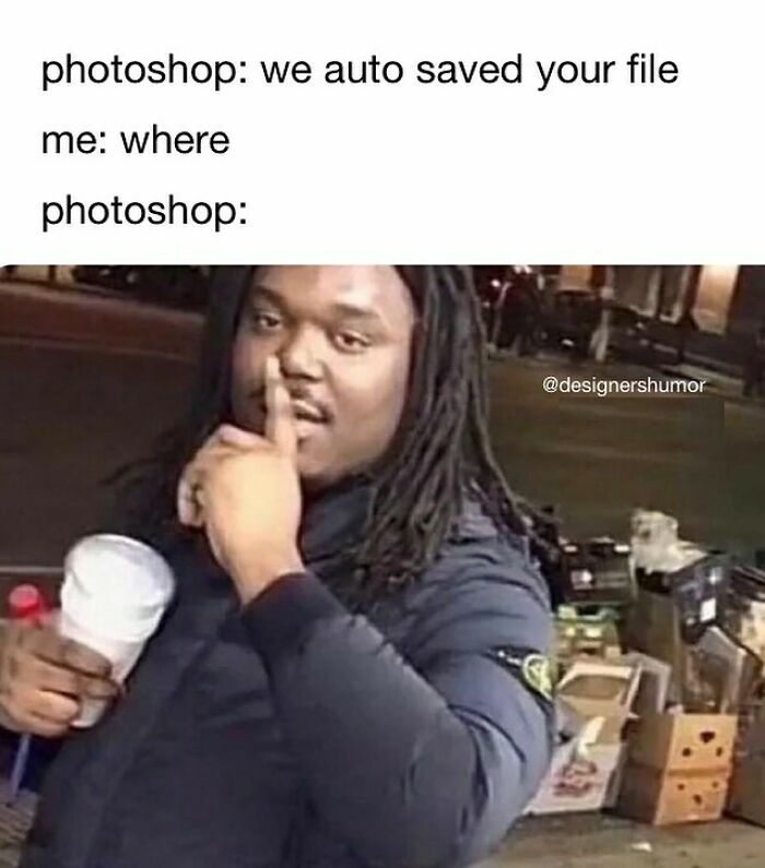 A man with a finger on his lips as photoshop auto saved a file, a funny moment for design humor.