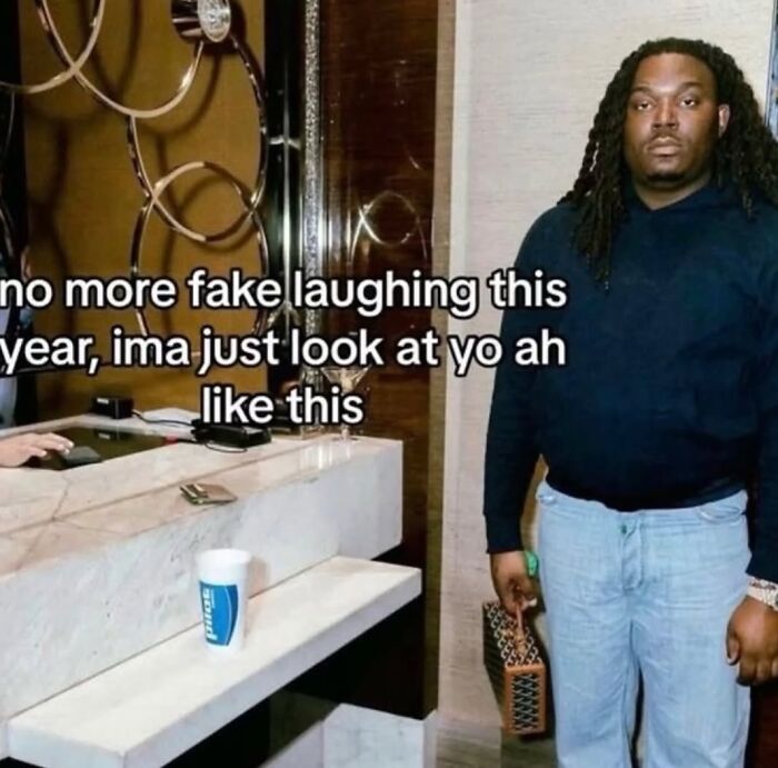 Cheerfully pessimistic meme of man refusing to fake laugh and staring seriously