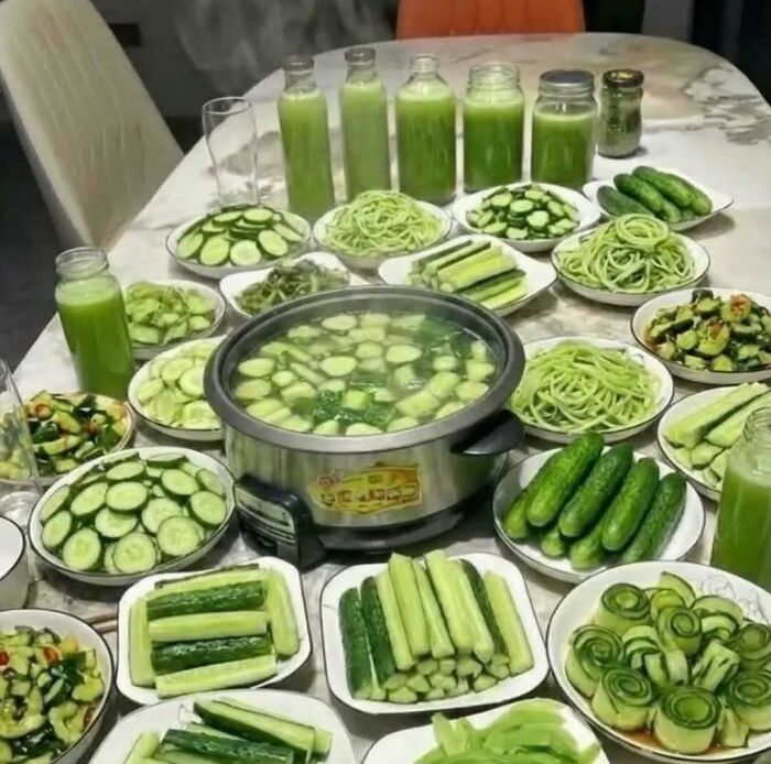 Table full of various cucumber dishes and drinks highlighting cucumber recipes