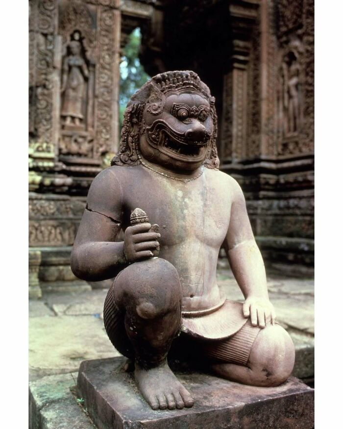 Historic stone statue of mythical figure at ancient site