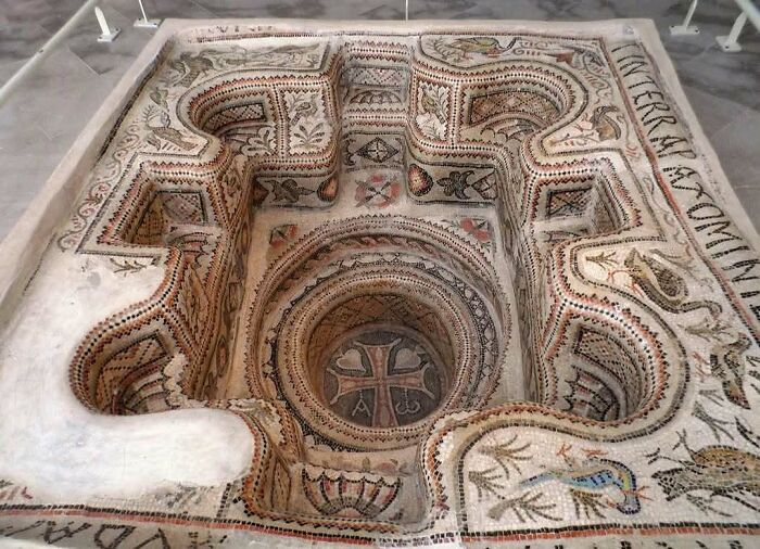 Intricately decorated ancient bath mosaic historical treasure with cross design