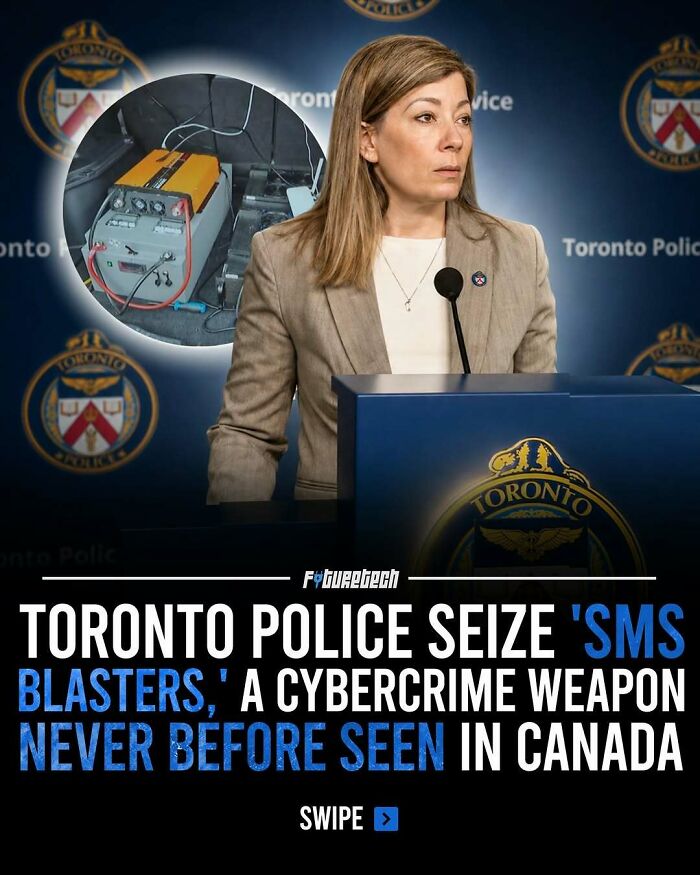A woman in a suit stands at a podium with the Toronto Police logo, displaying seized cybercrime future technology.