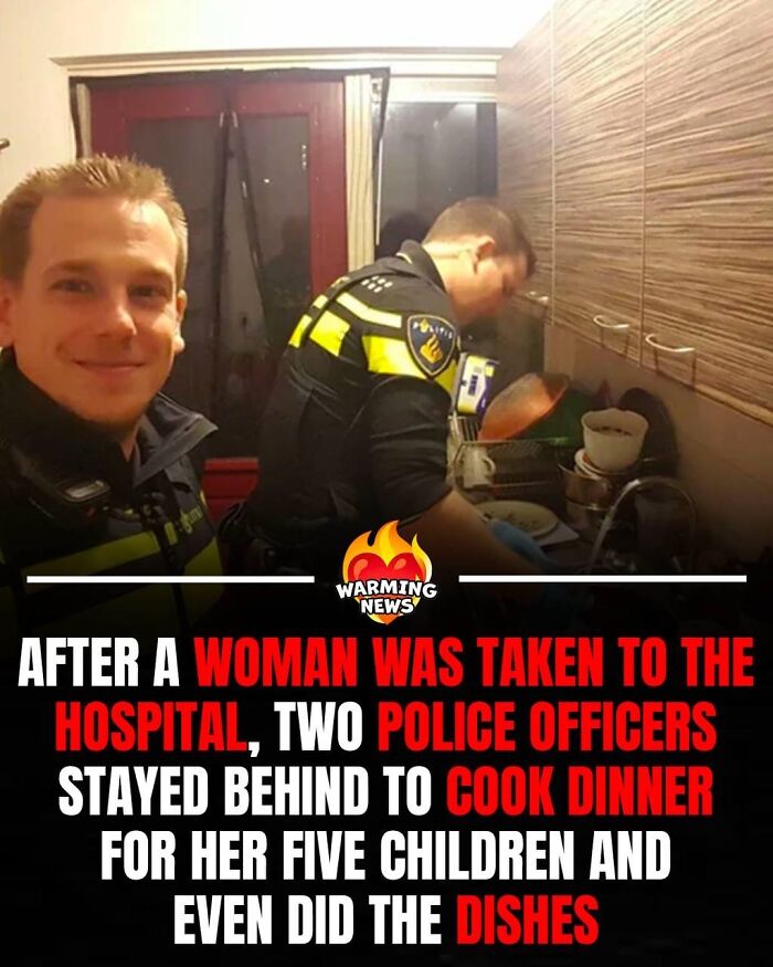 Two police officers wash dishes in a kitchen, a soul-healing image of help for a family during a rough month.