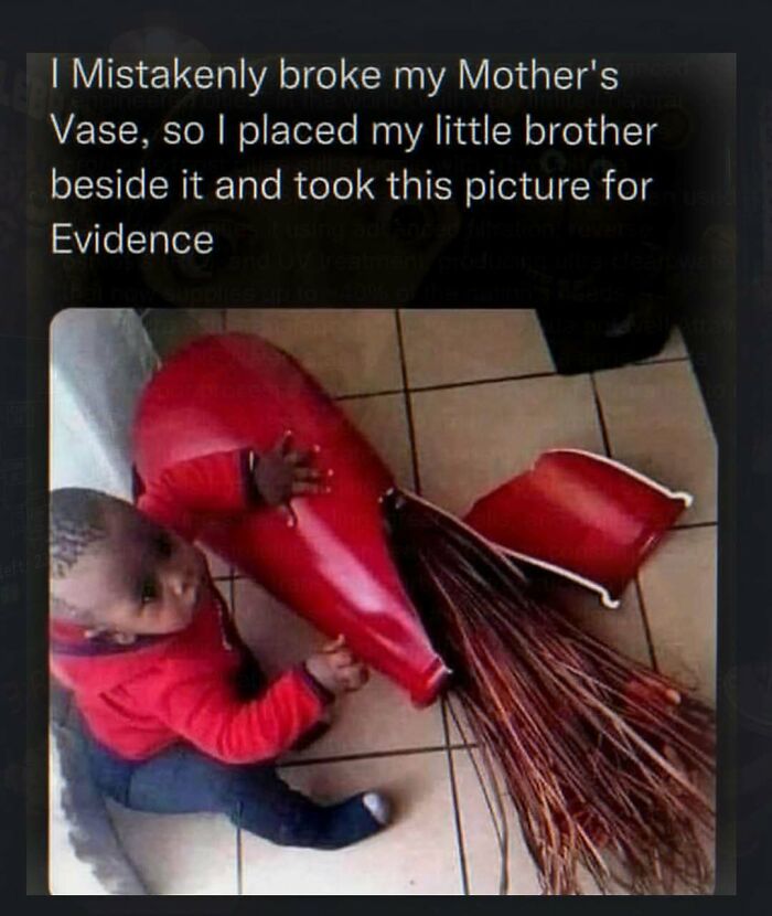 A baby next to a broken vase, looking at the camera. This is one of the chaotic and unhinged pics.