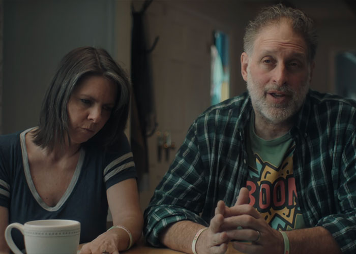 Man and woman discussing emotional family truths at home Man and woman discussing emotional family truths at home