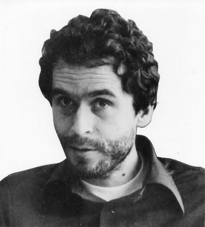 Black and white photo of male serial killer with curly hair