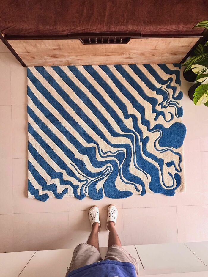 Abstract blue and white striped rug in interior design setup