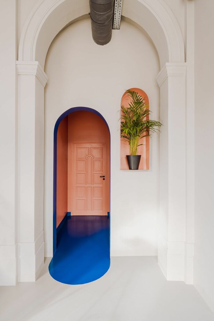 Colorful arched hallway with vibrant walls and modern interior design ideas