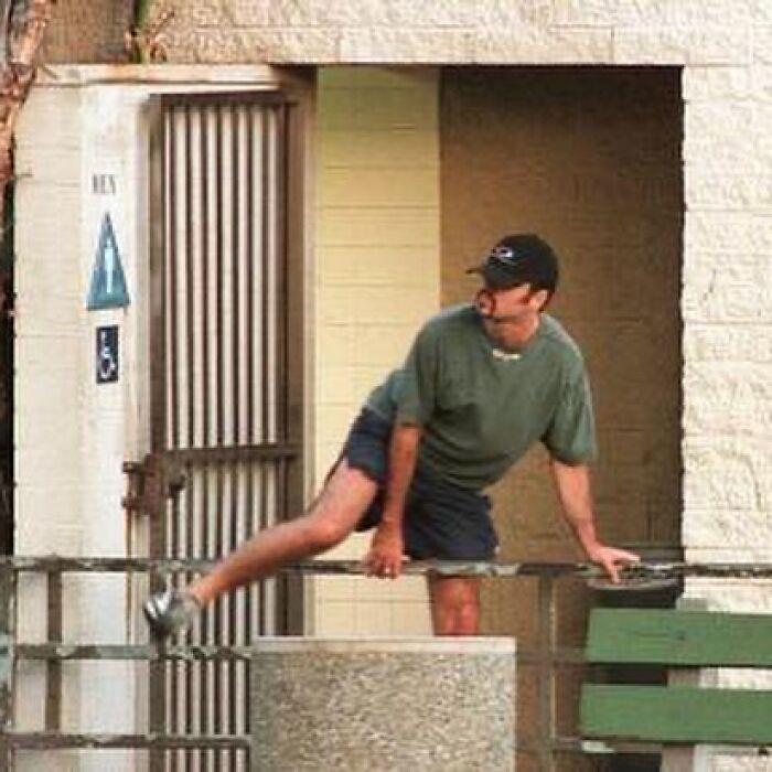 George Michael outside a public restroom, a scene from a celebrity scandal.