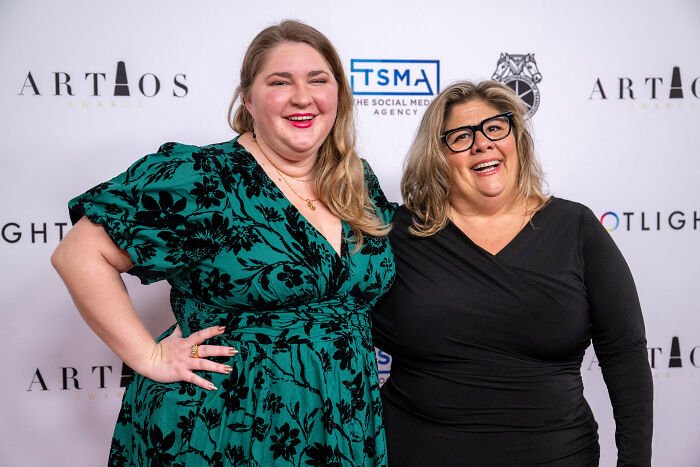 Two women smiling at an event, with hidden bias revealed in a major Netflix show casting.