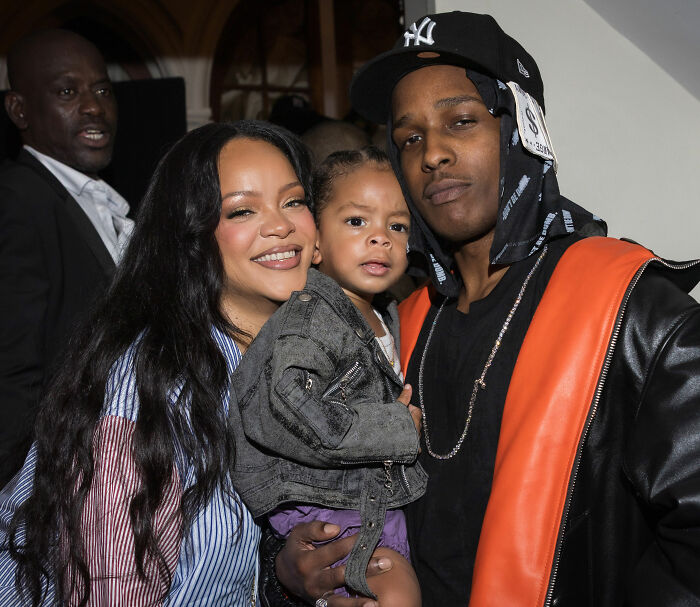Rihanna, her partner, and their child pose for a photo, amidst accusations of his disrespect.