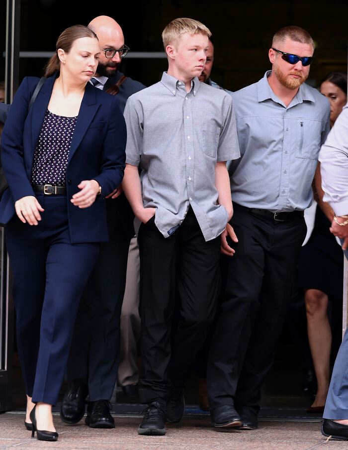 Group of people including Anna Kepner's stepbrother walking outside