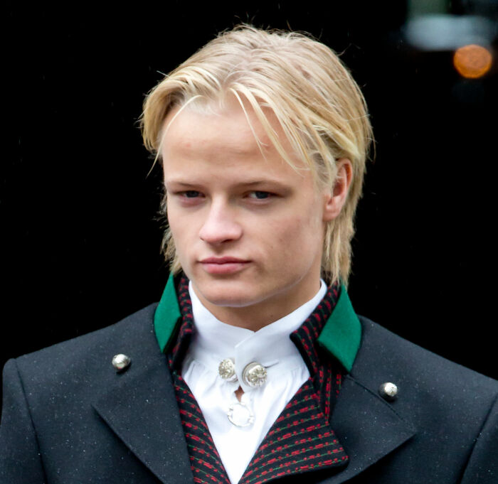 Norwegian Crown Princess's son wearing traditional outfit with serious expression Norwegian Crown Princess's son wearing traditional outfit with serious expression