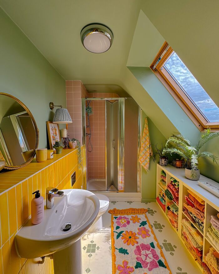 Bright bathroom interior design with green walls and yellow tiles