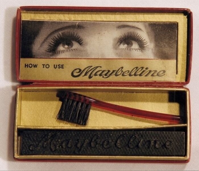 A vintage Maybelline mascara kit with a brush and cake mascara, an interesting object still intact.