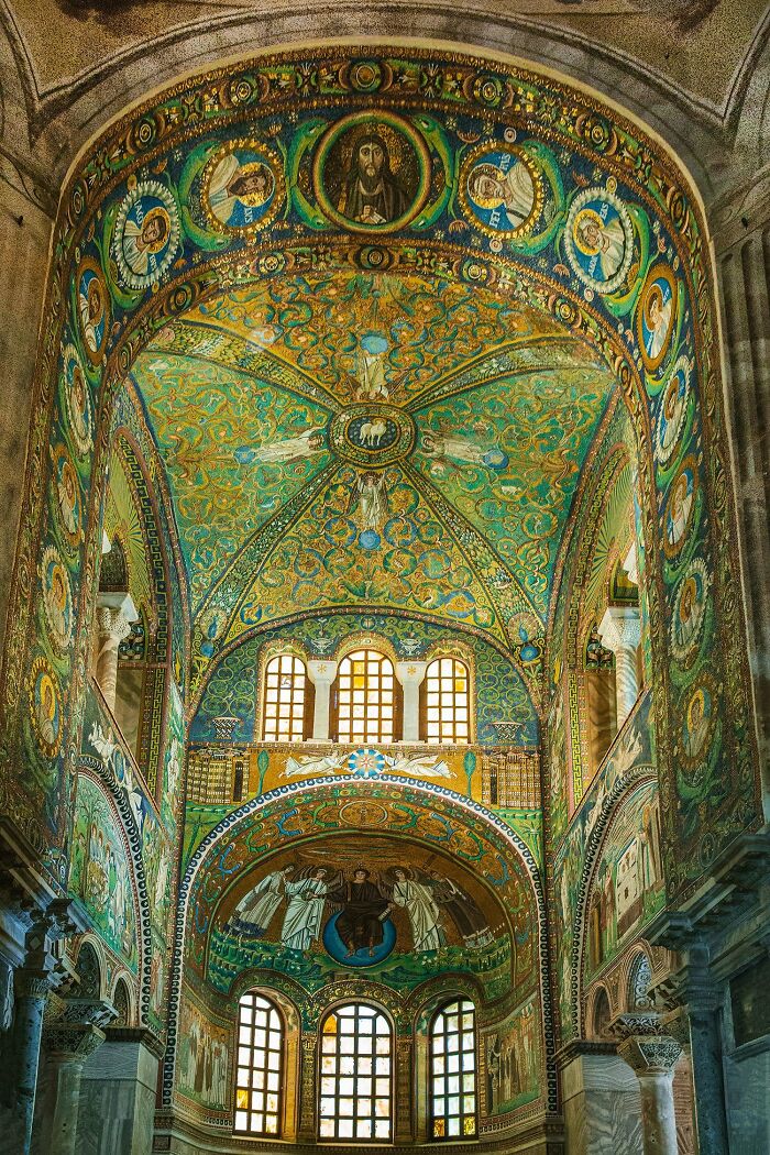 An intricately detailed mosaic ceiling inside an ancient building, still intact after all these years, a testament to enduring art.