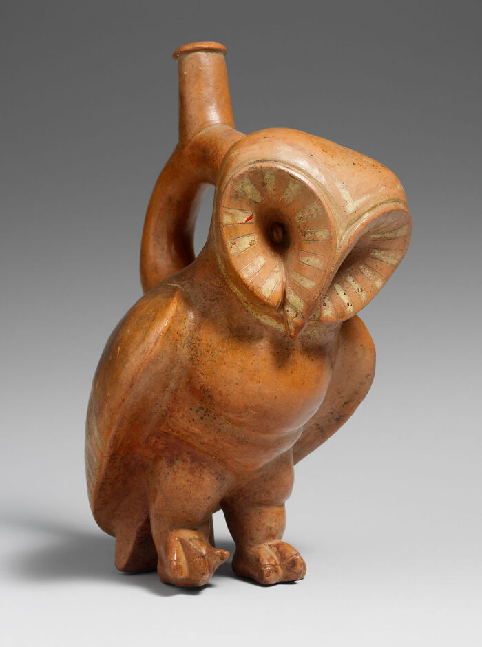 An ancient ceramic owl-shaped jug, an interesting object still intact after all these years, displaying historical pottery.
