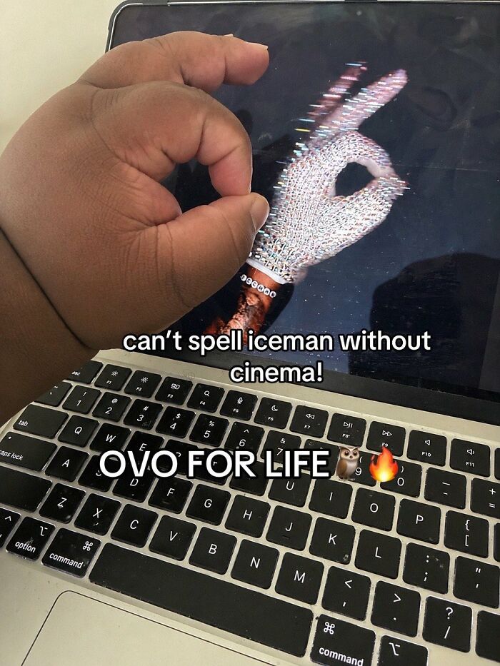 A hand forming an OK sign with a diamond ring projected onto a laptop, a cringe image that might cause pain.