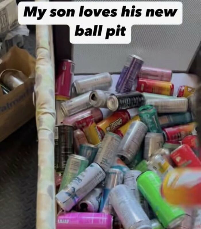 A box filled with empty soda cans, serving as a cringe makeshift ball pit, which might cause physical pain.