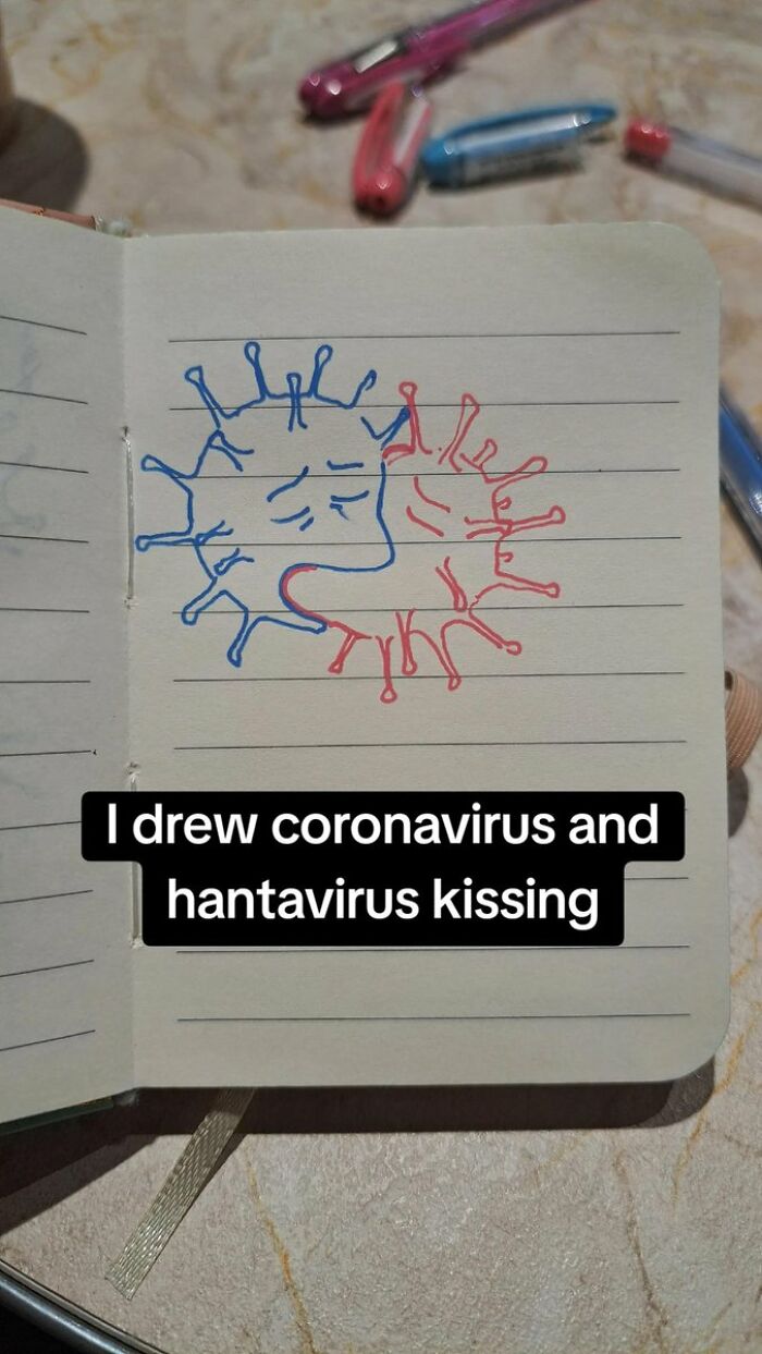 A notebook showing a cringe drawing of coronavirus and hantavirus kissing, which might cause physical pain.
