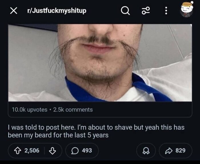 A cringe image of a man with an unkempt, long, and stringy beard and mustache.