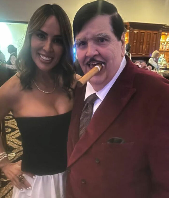 A photo of the guy Trump hired to renovate the Reflecting Pool, with a woman, at an event.