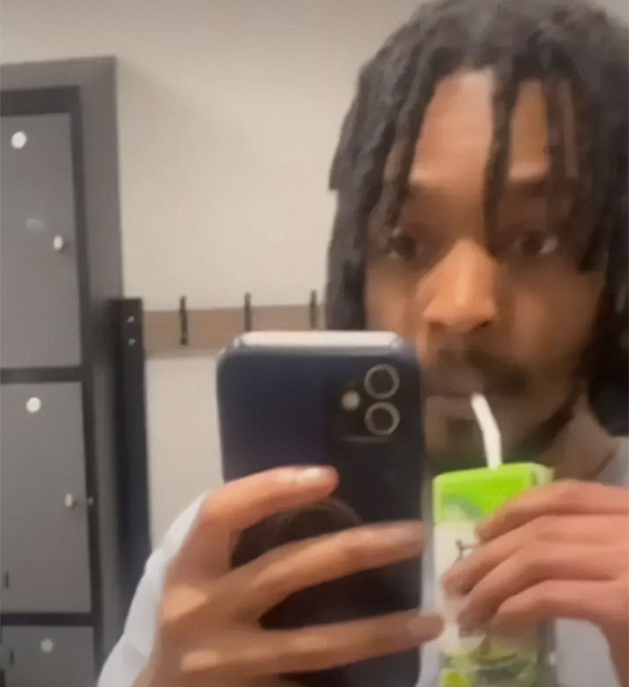 Male Karen filming an 80YO woman while relaxing on a public staircase, holding a phone and juice box.