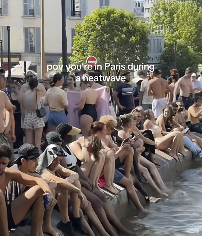 People sitting by a body of water in Paris, escaping the heat wave during Europe's climate crisis. People sitting by a body of water in Paris, escaping the heat wave during Europe's climate crisis.