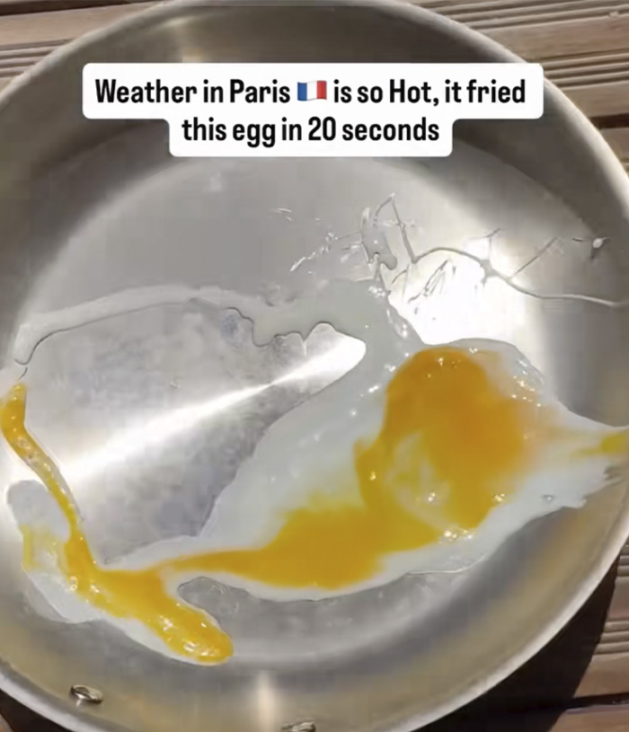 An egg frying in a pan without external heat, illustrating the extreme temperatures of the heat wave in Paris during a climate crisis. An egg frying in a pan without external heat, illustrating the extreme temperatures of the heat wave in Paris during a climate crisis.