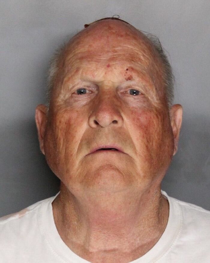 Close-up mugshot of elderly man with facial marks, related to serial killer facts