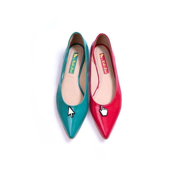Two pointed flats, one teal with a mouse cursor and one red with a hand cursor, by Kobi Levi creative shoes.