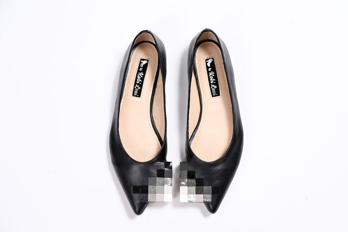 Kobi Levi creative and imaginative shoes with black and white pixelated design on the toe, on a white background.