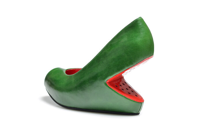 A single green Kobi Levi shoe, creatively designed to resemble a watermelon with red interior details.