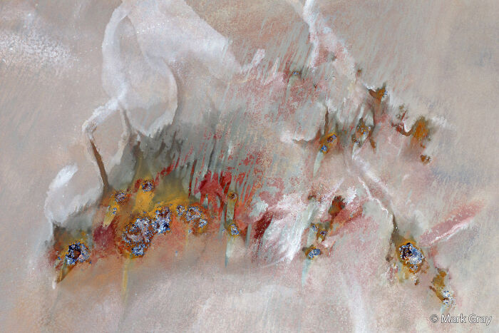 Abstract aerial landscape showing colorful mineral patterns from the Au Photo Contest.
