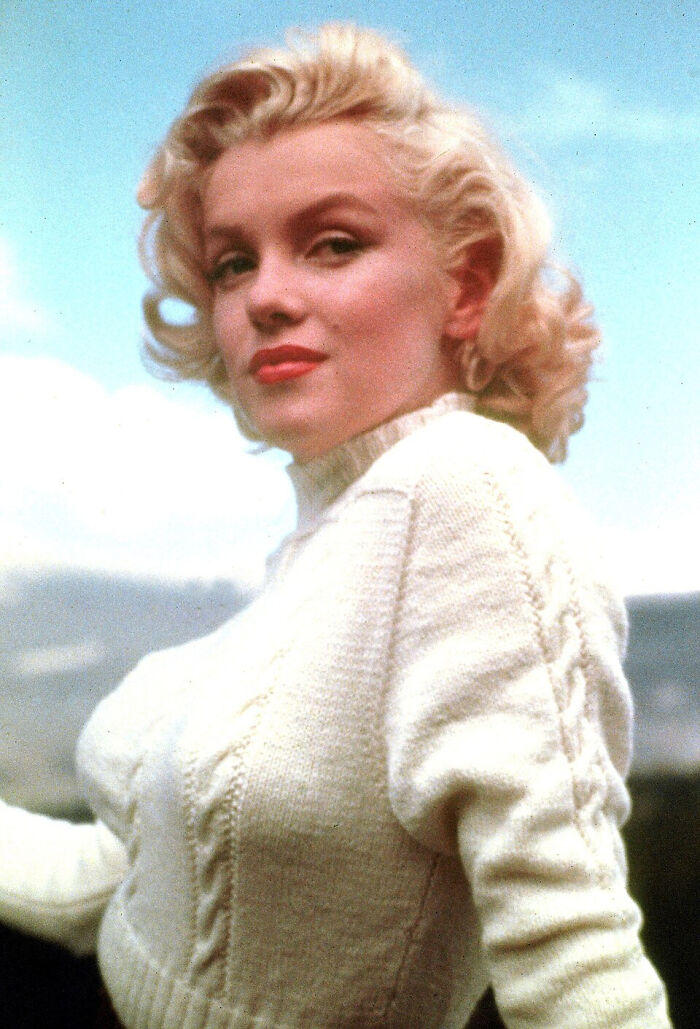 Marilyn Monroe looking directly at the camera, a surprising fact about a famous person.