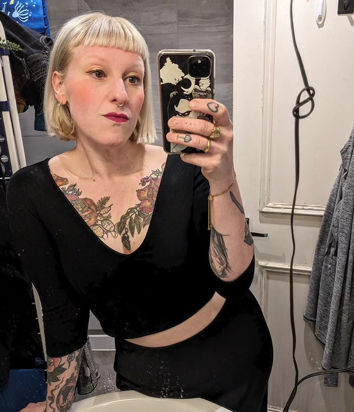 A woman with visible tattoos taking a selfie, showing confidence after realizing her mistake and working on her marriage. A woman with visible tattoos taking a selfie, showing confidence after realizing her mistake and working on her marriage.