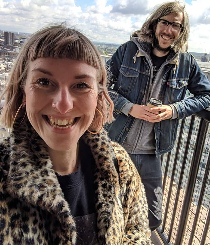 A happy couple on a balcony overlooking a city, smiling, suggesting a restored and strong marriage after a past mistake. A happy couple on a balcony overlooking a city, smiling, suggesting a restored and strong marriage after a past mistake.