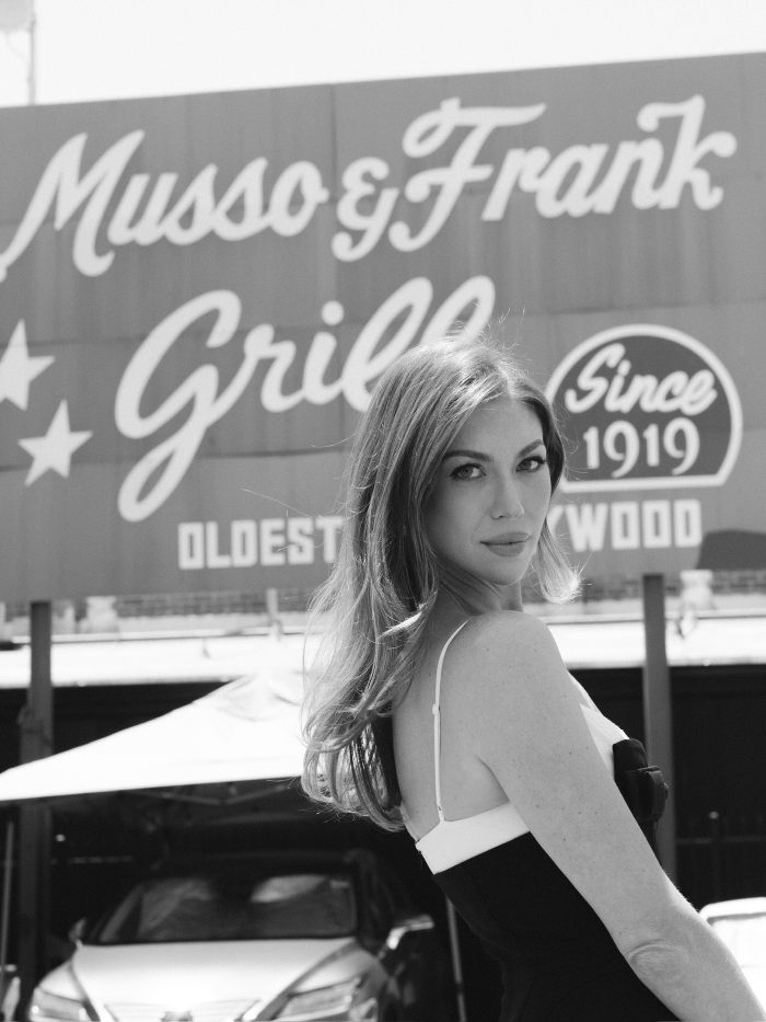 Black and white photo of Miami Swim Week model outside Musso & Frank Grill Black and white photo of Miami Swim Week model outside Musso & Frank Grill