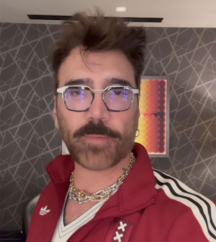 World Cup opening ceremony headliner wearing glasses and a red jacket selfie