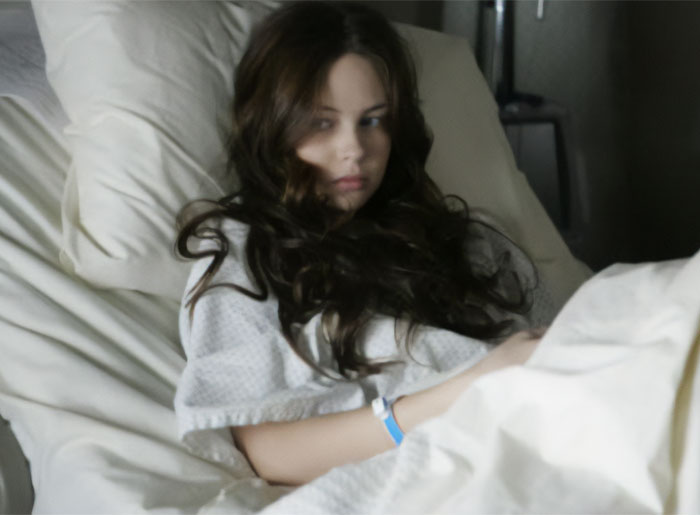 Lilo & Stitch actress Daveigh Chase in a hospital bed, looking at the camera. Lilo & Stitch actress Daveigh Chase in a hospital bed, looking at the camera.