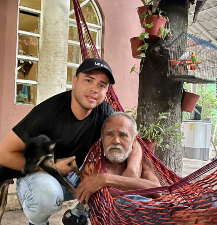 Mayor with a town dad in a hammock, celebrating Father's Day, fostering good vibes.