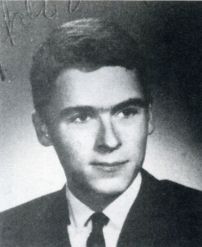 Black and white high school style photo of a young man serial killer